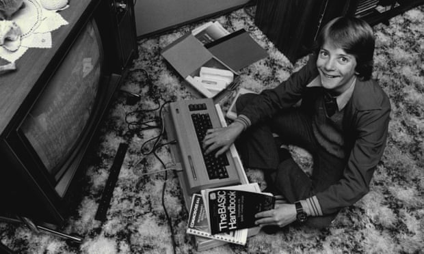 Jaddua McAdam, 13, in his home in Sydney, Australia, programmes his Commodore 64, 7 October 1983