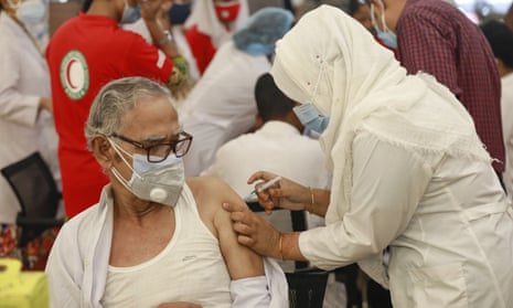 A man receives a dose of Covid-19 coronavirus vaccine in Dhaka