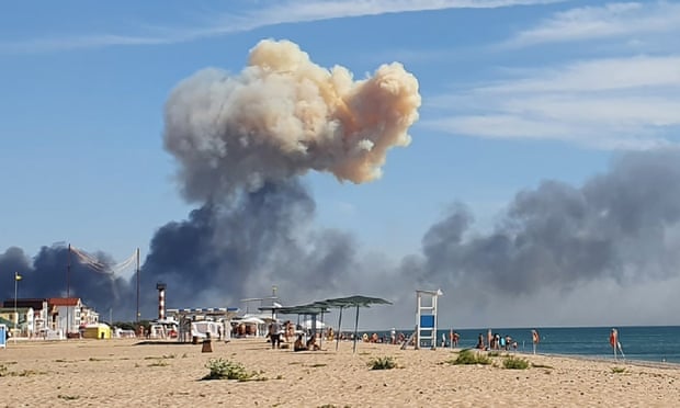 Rising smoke can be seen from the beach at Saky after the airbase attack.