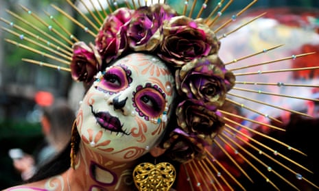 A woman takes part in the “Catrinas Parade” in Mexico City.