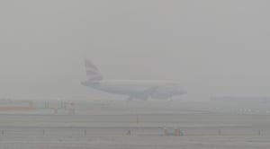 A British Airways plane at Heathrow as dense fog causes travel disruption across southern England