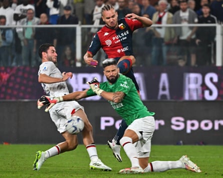 Olivier Giroud punches clear for Milan against Genoa back in 2023.