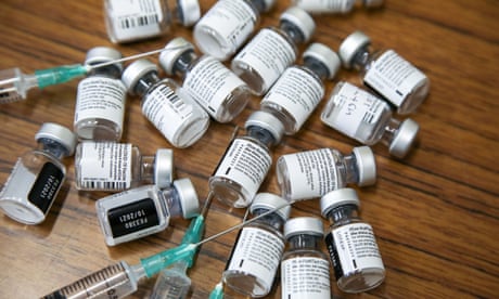 Pfizer vaccine vials with needles