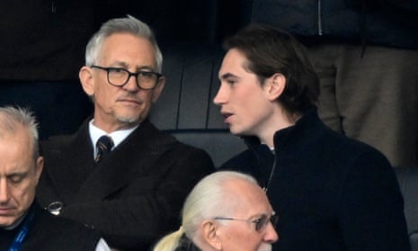 Gary Lineker watches Leicester City v Chelsea with his son on Saturday as the row grows over his suspension as Match of the Day host.