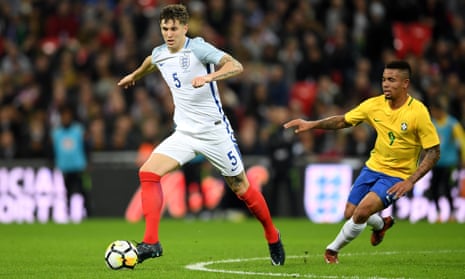 John Stones brings the ball away from his Manchester City team-mate Gabriel Jesus of Brazil during England’s goalless draw at Wembley on Tuesday.