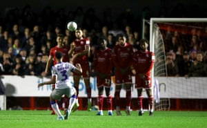 Colchester’s Cohen Bramall sends the free-kick over the wall, the ball hits the bar and rebounds off the keeper into the back of the next for their second.
