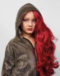 A Canadian child wearing makeup, a long cherry-red wig and sequined hoodie