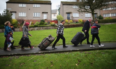 Syrian refugee families arrive at their new homes on the Isle of Bute, Scotland, last year.