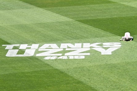Usman Khawaja performs a sajdah on the field as he walks off