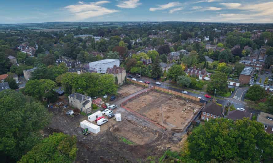 Aerial view of a patch of bare ground next to a leafy suburban street in Cambridge Aerial view of a patch of bare ground next to a leafy suburban street in Cambridge