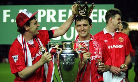 Bryan Robson (centre) and Steve Bruce with the Premier League trophy in 1993.