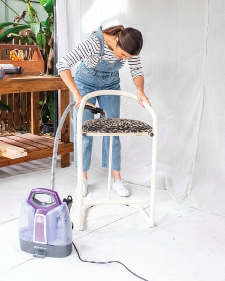 Geneva Vanderzeil steam cleaning fabric on a chair
