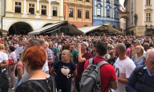 Scores of tourists take photos of the historic Astronomical Clock in Prague’s old town square as it strikes the hour.