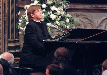 Elton John at the piano plays a specially rewritten version of Candle in the Wind at Diana’s funeral service.