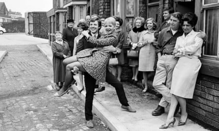 Mitzi Rogers, centre, as Jenny Sutton, in the arms of Philip Lowrie, playing her husband, Dennis Tanner, on the set of Coronation Street in 1968.