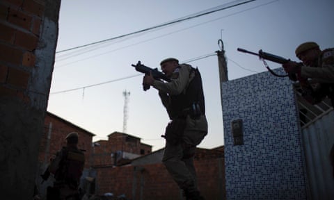 Member of the elite police unit Rondesp raid Feira de Santana’s favelas, wielding submachine guns and assault rifles.