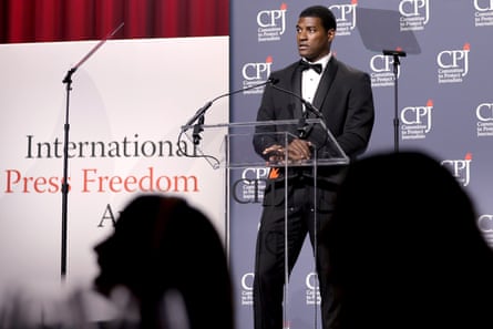 A man in front of a microphone