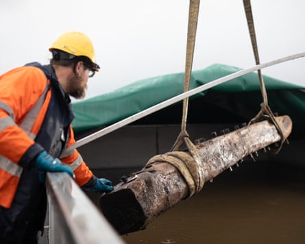 Ben Saunders supervises the timbers from the wreck as they are placed in a freshwater tank to preserve them.