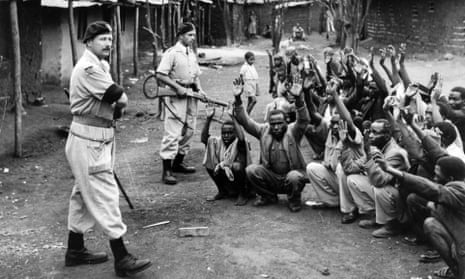 Members of the Devon Regiment assisting police in searching homes for Mau Mau rebels, Karoibangi, Kenya, circa 1954.