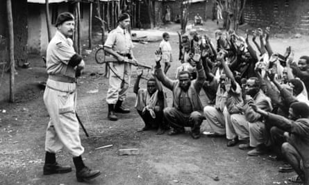 British soldiers assist police searching for Mau Mau members, Karoibangi, Kenya, 1954