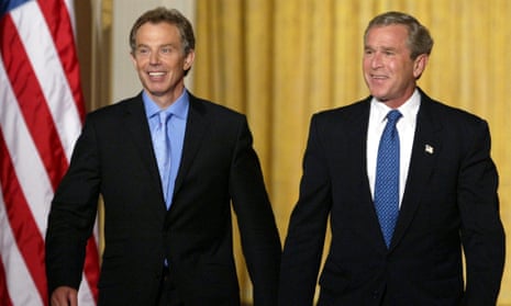 Tony Blair (left) and George W Bush walk to a joint press conference at the White House on 17 July 2003