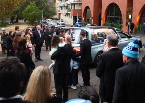 The Daniher family farewell the hearse after Neale Daniher’s state funeral