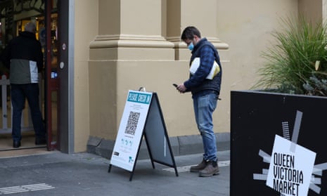 A man scans a QR code at the entrance of Queen Victoria Market in Melbourne in August. The state government has launched an update to the Service Victoria QR code check-in app, which allows users to share their Covid vaccination certificate.