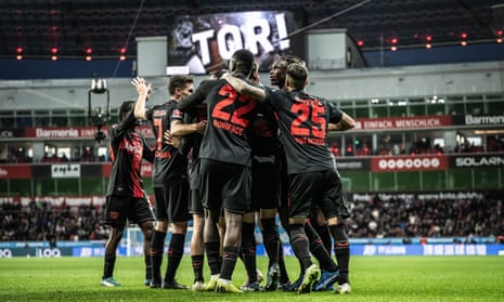 Bayer Leverkusen players celebrate after Jonathan Tah scored the third goal in the 4-0 win against Union Berlin.