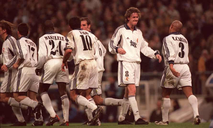 Real Madrid's Steve McManaman celebrates a goal against Malaga with Roberto Carlos in February 2001