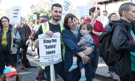 Tyrone Halligan, Amelia Friend and their two-year-old son Isaac at the demonstration