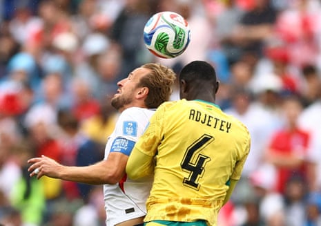 England's Harry Kane and Ghana's Jonas Adjetey go up for a header.