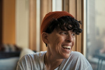 Poet Andrea Gibson laughing.