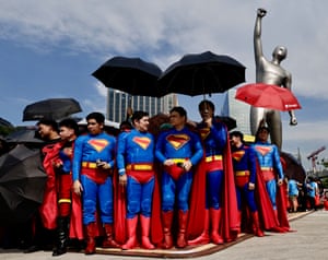 Lots of people wearing Superman costumes