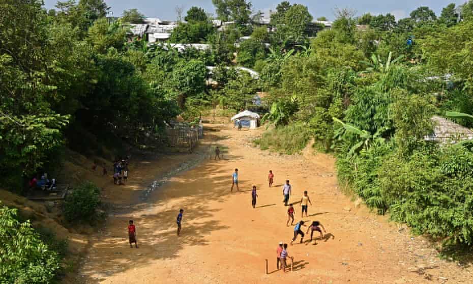 Children of Rohingya refugees play football at a camp in Ukhia.