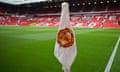 A limp corner flag displaying the Manchester United crest is seen at Old Trafford on Saturday