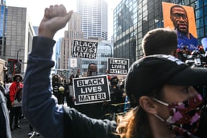 Demonstrators hold placards during the I Can’t Breathe Silent March for Justice