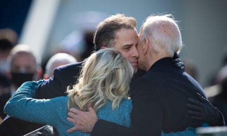 Hunter Biden embraces Jill and Joe Biden at the president’s inauguration in Washington on 20 January.
