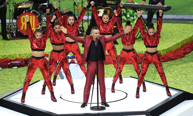 Robbie Williams performs in the opening ceremony.
