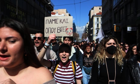 People and a train workers' union take part in a demonstration in Athens, Greece, on March 3, 2023.