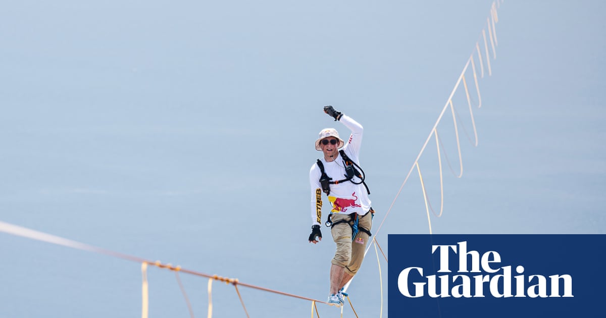 Daredevil Jaan Roose prepares to walk slackline high above central Seoul