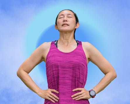 A sporty woman takes a deep breath