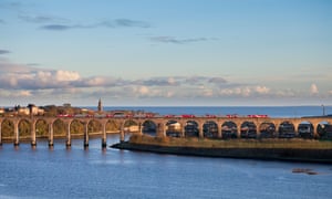 A train crosses the Royal border bridge at Berwick upon Tweed