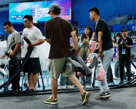 A robot is carried off after a kickboxing match on at the games
