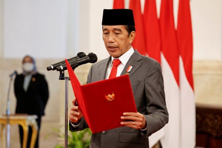 Indonesia’s President Joko Widodo talking at a microphone