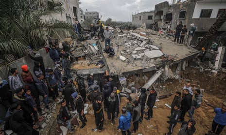Palestinians searching for survivors after Israeli airstries in Deir al-Balah, Gaza, last month.