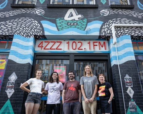 Station staff stand out the front of 4zzz in Brisbane. The community radio station turns 50 on 8 December.