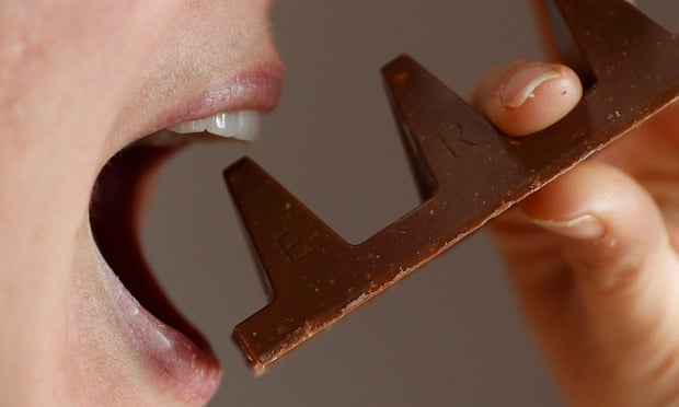 A woman eating one of the new gappier Toblerone bars