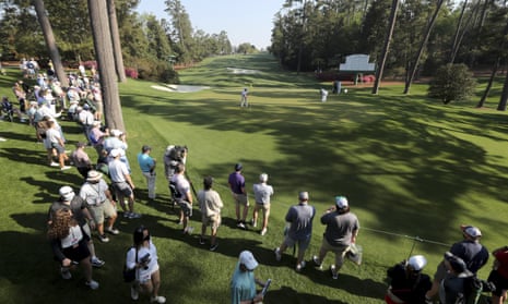 Bryson DeChambeau (centre) and Phil Mickelson (back right) prepare to putt on the 10th tee during a practice round for the Masters on Wednesday.