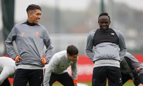Sadio Mané, who Jürgen Klopp says is ready to start at Spartak Moscow, shares a joke with Roberto Firmino during Liverpool training before the Champions League match.