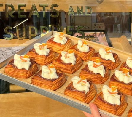 A tray of pastries being taken to the shelves